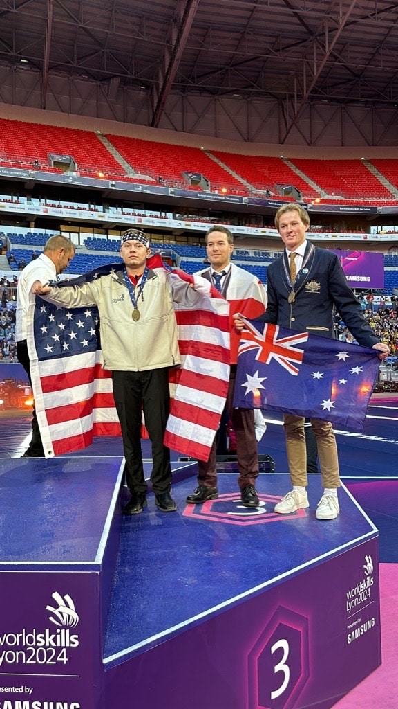 Photo of Wyatt Hansen on stage at the WorldSkills Competition