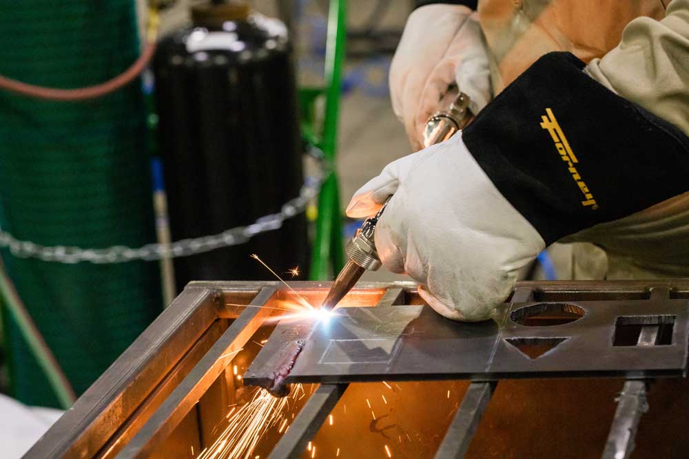 Close of of welding a piece of metal.