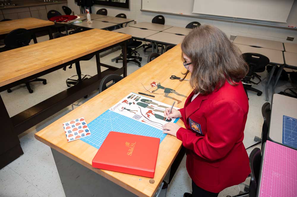 A student putting together a presentation.